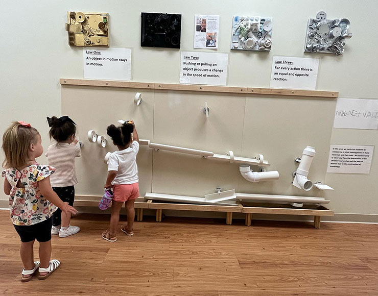 preschoolers at a learning station