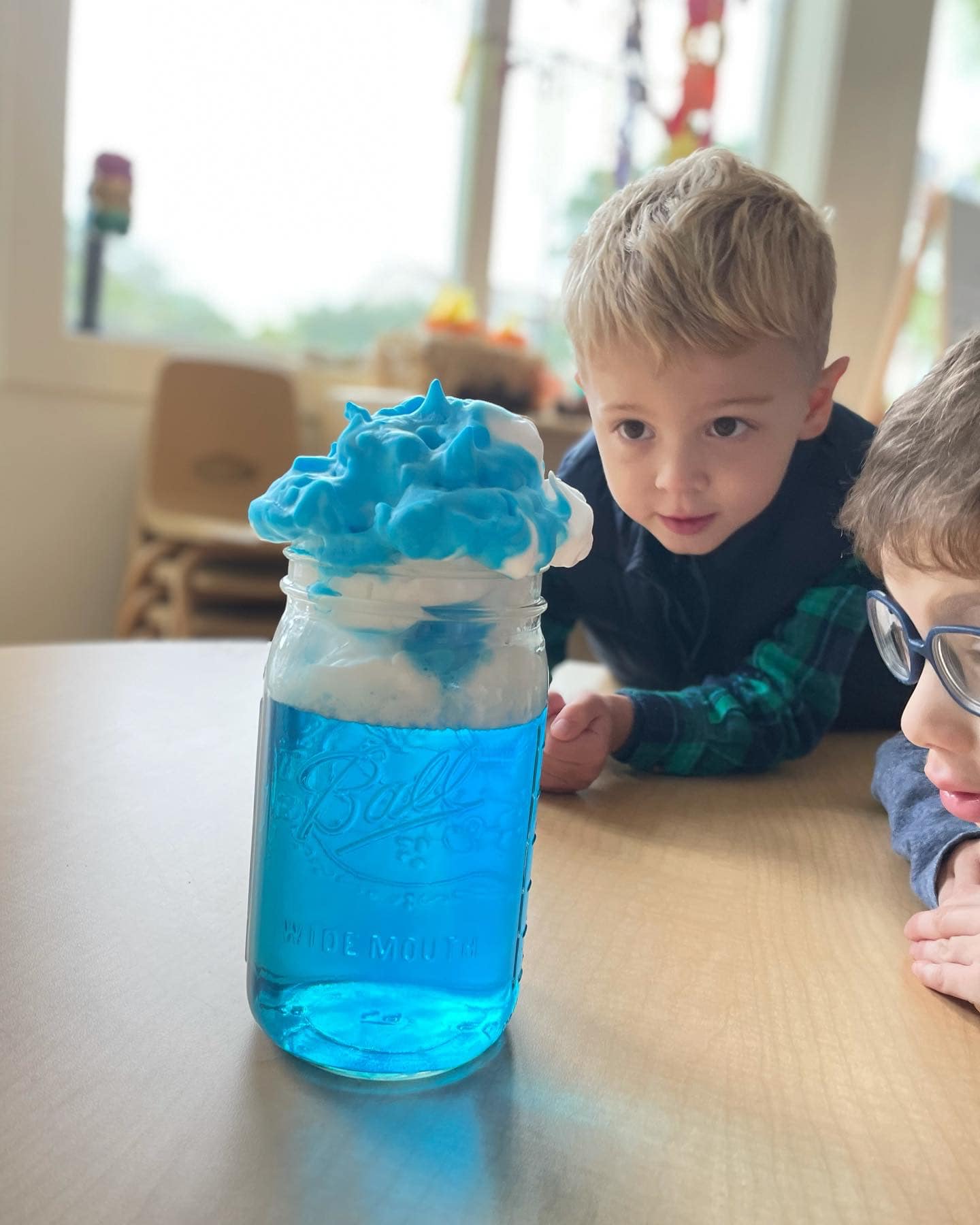 Preschoolers engaged in a hands-on science activity at Ivybrook Academy